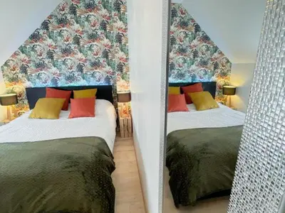 Un ou plusieurs lits dans un hébergement de l'établissement Gîte à Luzillé avec jardin privé et climatisation - FR-1-381-532