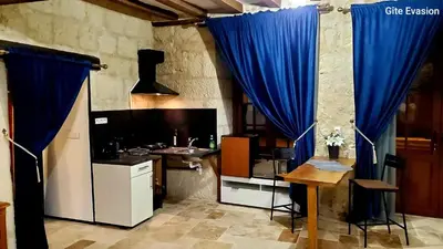 Cuisine ou kitchenette dans l'établissement Évasion