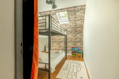 Un ou plusieurs lits dans un hébergement de l'établissement La Bulle Détente : Maison avec Jacuzzi et Sauna