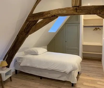 Un ou plusieurs lits dans un hébergement de l'établissement Gîte de la Forge, l'Atelier