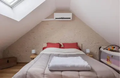 Un ou plusieurs lits dans un hébergement de l'établissement Gîte Le Clos Controis