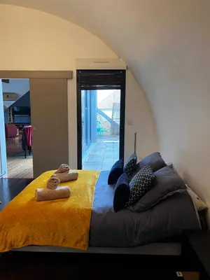 Un ou plusieurs lits dans un hébergement de l'établissement Magnifique loft 130m2 Le Mans
