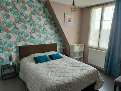 Un ou plusieurs lits dans un hébergement de l'établissement Les Chambres du Faubourg