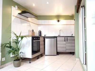 Cuisine ou kitchenette dans l'établissement Dupplex, centre ville