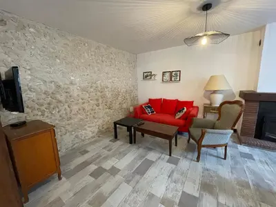 Télévision ou salle de divertissement dans l'établissement La Maison de Marion