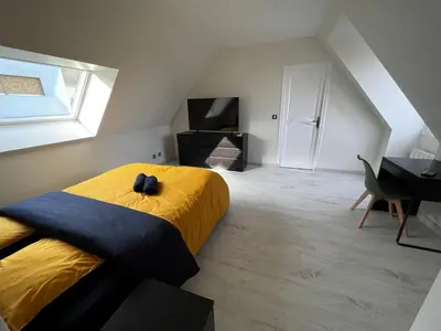 Un ou plusieurs lits dans un hébergement de l'établissement Villa avec piscine à 10 min du circuit des 24h du Mans