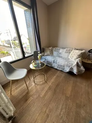 Coin salon dans l'établissement Maison de ville idéalement placée