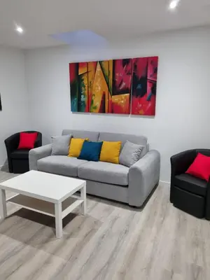 Coin salon dans l'établissement Au Petit Ronceraie