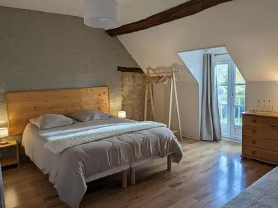 Un ou plusieurs lits dans un hébergement de l'établissement Maison dans belle longère - La Serrerie