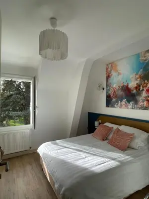 Un ou plusieurs lits dans un hébergement de l'établissement Aux Chambres des Dames