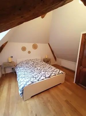 Un ou plusieurs lits dans un hébergement de l'établissement Gîte avec vue sur l'Indre