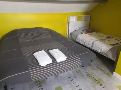 Un ou plusieurs lits dans un hébergement de l'établissement Maison de centre-ville