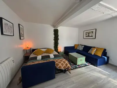 Un ou plusieurs lits dans un hébergement de l'établissement Le Troglogite Mignon - Maison et Jardin