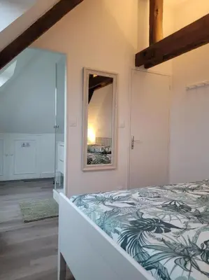 Un ou plusieurs lits dans un hébergement de l'établissement Appartement avec vue sur Loire