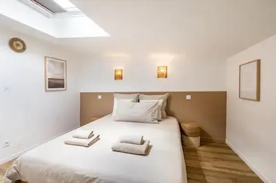 Un ou plusieurs lits dans un hébergement de l'établissement Chaleureuse maisonnette