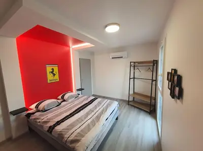 Un ou plusieurs lits dans un hébergement de l'établissement Maison à thème le Mans 66