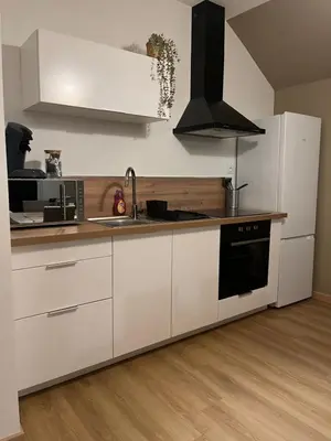 Cuisine ou kitchenette dans l'établissement Maison « Le moulin à vent »
