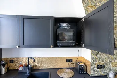 Cuisine ou kitchenette dans l'établissement L'Instant D'Ambre - Parking - Centre - Clim