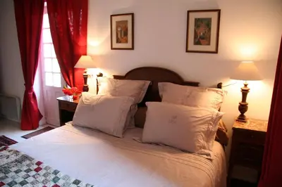 Un ou plusieurs lits dans un hébergement de l'établissement Château de Bournand B&B