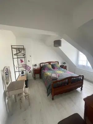 Un ou plusieurs lits dans un hébergement de l'établissement Appartement Mansoreau