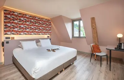 Un ou plusieurs lits dans un hébergement de l'établissement La Maison Rabelais
