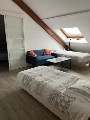 Un ou plusieurs lits dans un hébergement de l'établissement Appartement en résidence avec parking