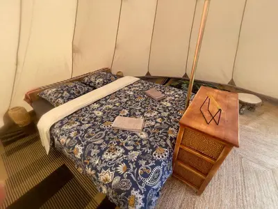 Un ou plusieurs lits dans un hébergement de l'établissement Chalet au cœur de la nature