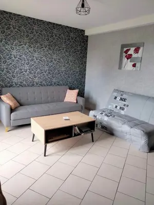 Coin salon dans l'établissement Ferme de l'Etang - Gîte