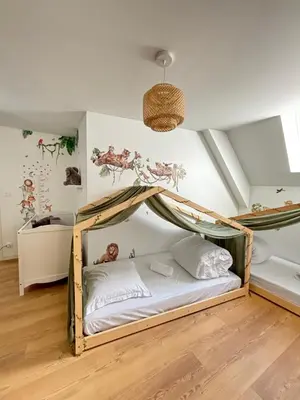 Un ou plusieurs lits dans un hébergement de l'établissement Le Duplex Safari