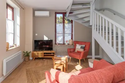 Coin salon dans l'établissement Duplex avec parking privé les Cahiers de Vacances