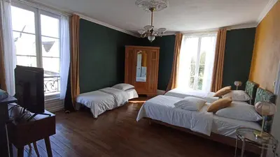 Un ou plusieurs lits dans un hébergement de l'établissement Villa du Loir