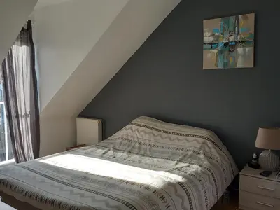 Un ou plusieurs lits dans un hébergement de l'établissement Maison climatisée proche circuit des 24H