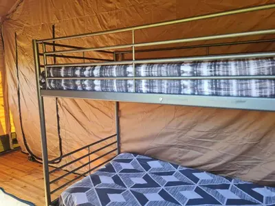 Un ou plusieurs lits dans un hébergement de l'établissement Camping de la touche