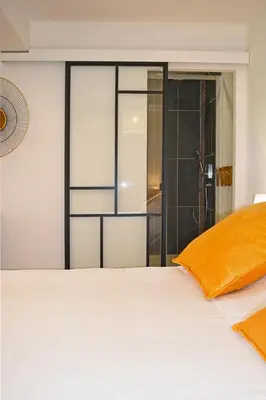 Un ou plusieurs lits dans un hébergement de l'établissement Manoir Drissia - Tours Centre, France