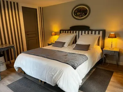 Un ou plusieurs lits dans un hébergement de l'établissement chambre d'hôtes dans un moulin du 16ème