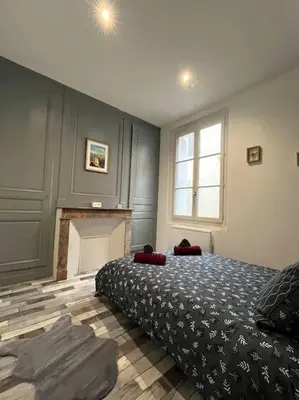 Un ou plusieurs lits dans un hébergement de l'établissement Au pied du château