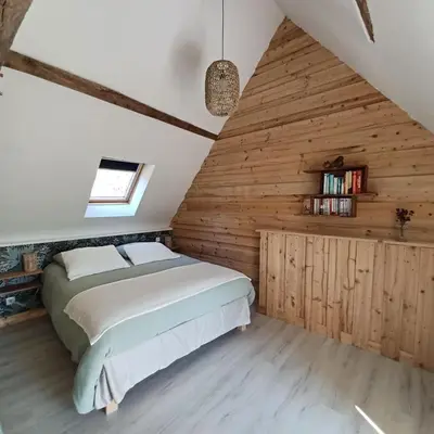 Un ou plusieurs lits dans un hébergement de l'établissement Maison en lisière de forêt