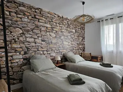 Un ou plusieurs lits dans un hébergement de l'établissement Maison a la campagne