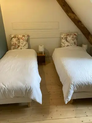Un ou plusieurs lits dans un hébergement de l'établissement Cottage au calme entre vignes et champs, au coeur du pays des châteaux