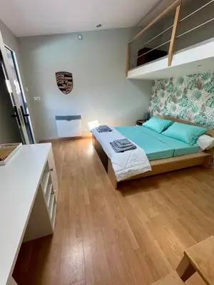 Un ou plusieurs lits dans un hébergement de l'établissement Chambre chez l'habitant avec piscine 400m Circuit 24h Le Mans