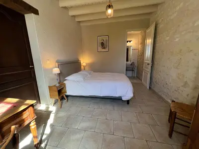 Un ou plusieurs lits dans un hébergement de l'établissement La Closerie – Château de Thésée