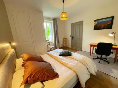 Un ou plusieurs lits dans un hébergement de l'établissement Gîte rénové avec billard, baby-foot, jardin clos, recharge VE, proche châteaux de la Loire - FR-1-381-575