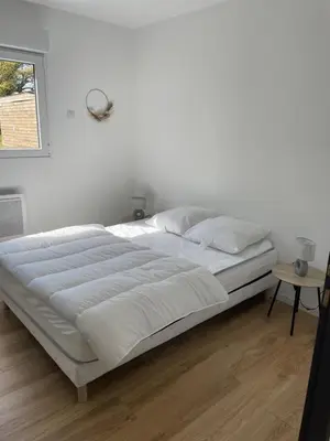 Un ou plusieurs lits dans un hébergement de l'établissement Les Chalets du Mancel : Chalet Lulu - Bouleries Jump - 24h du Mans