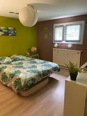 Un ou plusieurs lits dans un hébergement de l'établissement Maison d Angele 4 chambres