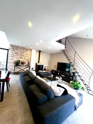 Coin salon dans l'établissement Maison à 5 minutes des 24H du Mans