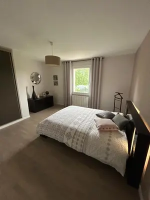 Un ou plusieurs lits dans un hébergement de l'établissement Charmante maison proche des 24h du Mans