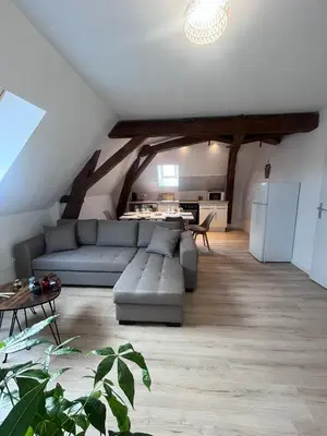 Coin salon dans l'établissement L'évasion urbaine - Parking gratuit - Entrée autonome - Wifi