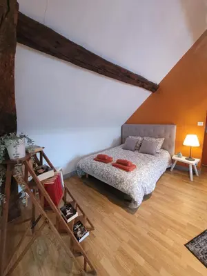 Un ou plusieurs lits dans un hébergement de l'établissement La maison aux iris
