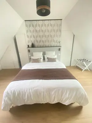 Un ou plusieurs lits dans un hébergement de l'établissement Les chambres d'hôtes du petit bois