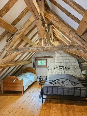 Un ou plusieurs lits dans un hébergement de l'établissement Moulin de Galerne, Le gite Du Four à Pain